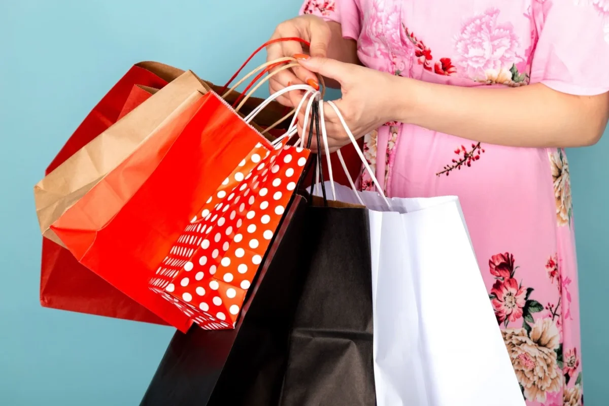 woman holding paper bags