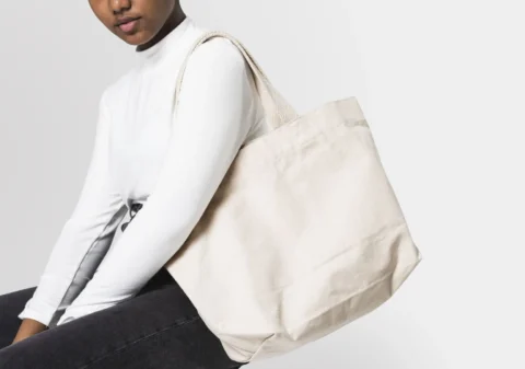 woman with white tote bag_