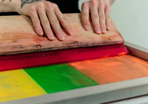 person holding brown wooden board