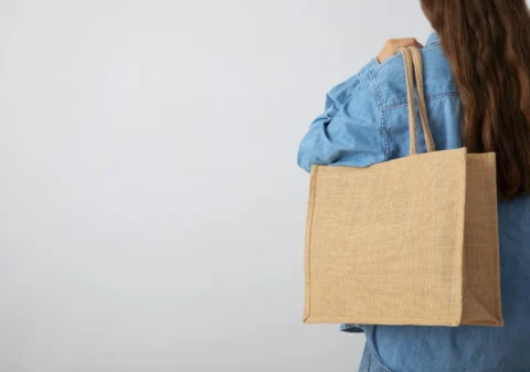 woman holding tote bag